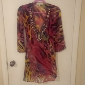 Solitaire Women's top/pool cover. Size small, 100% polyester, see through.